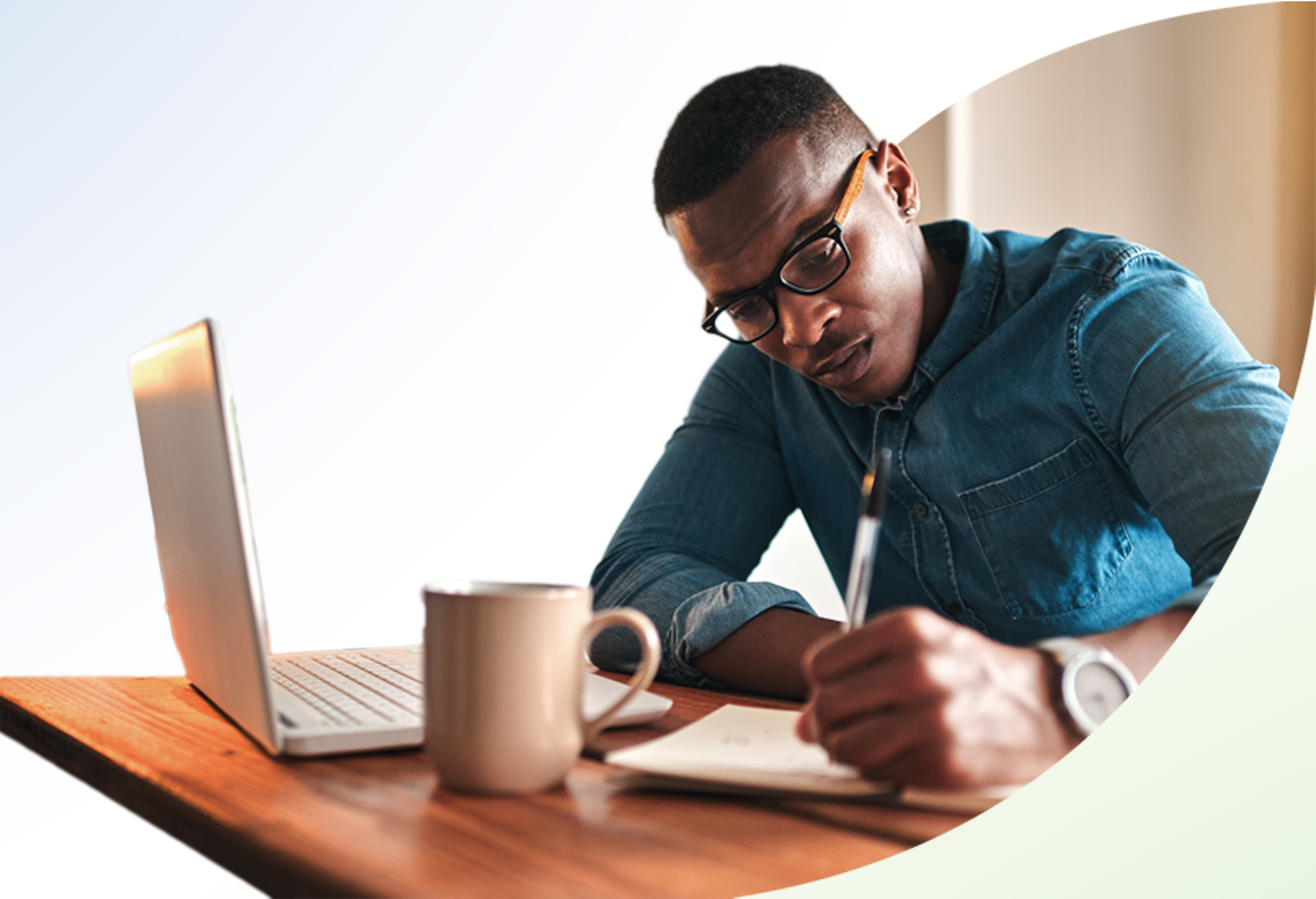 Man at desk focusing on work.