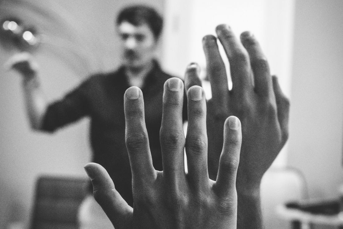 Hand holding a light bulb