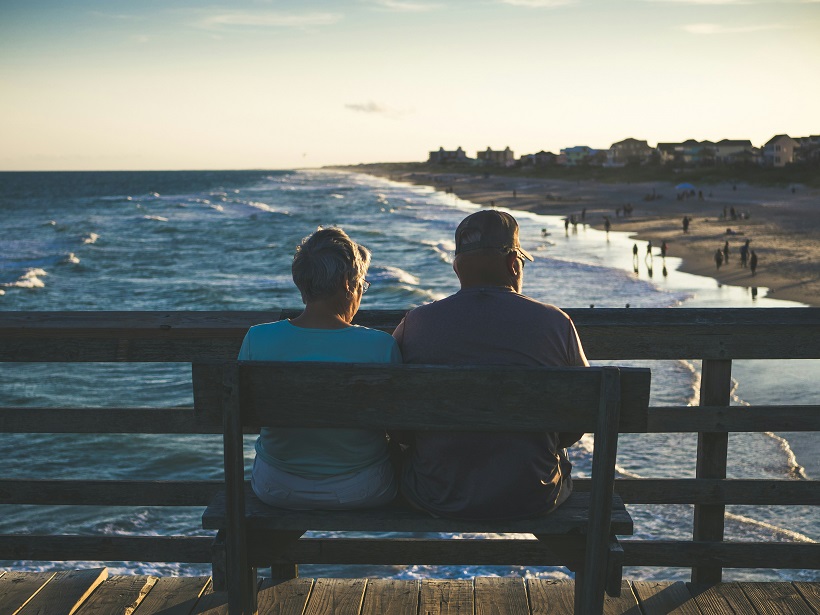 retired couple on the beach