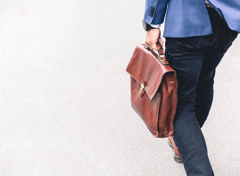 Man walking with briefcase in hand