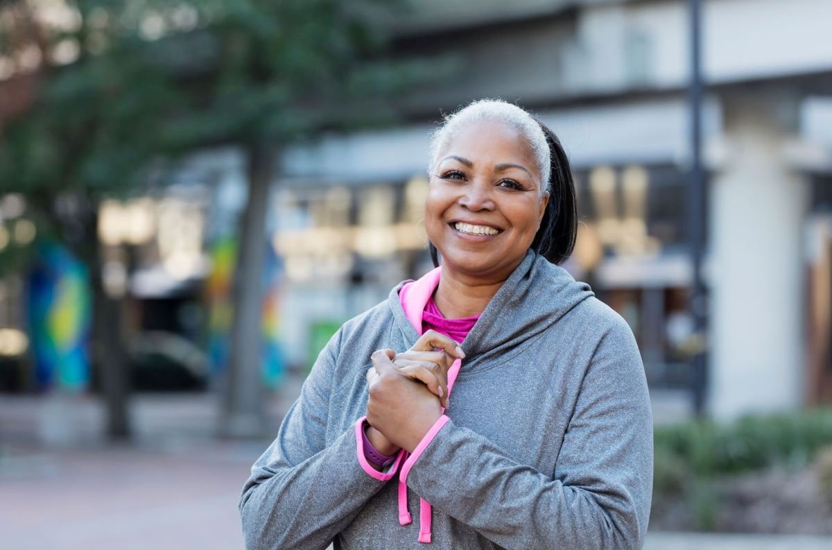 Mature woman smiling outside