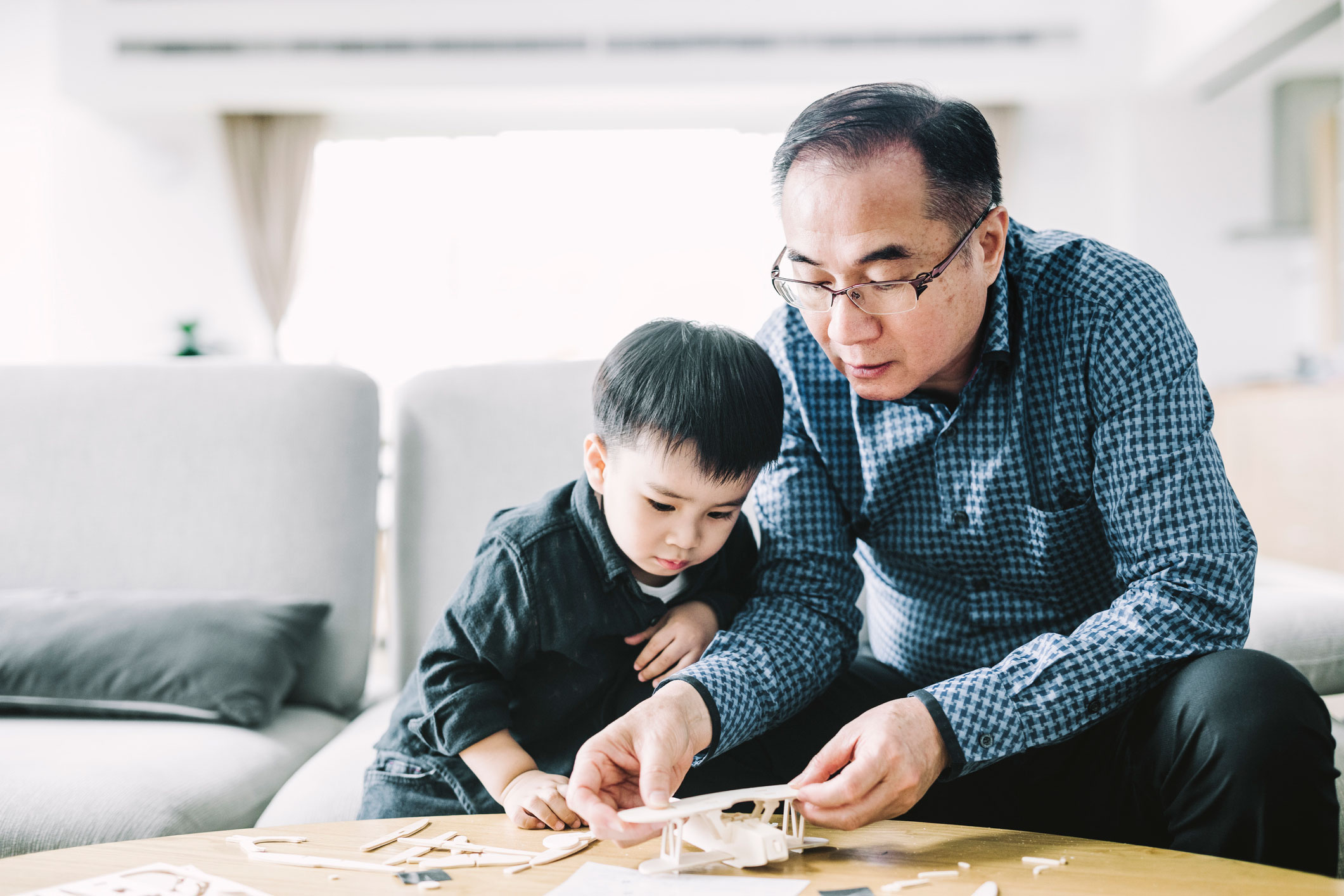 Man with young family member