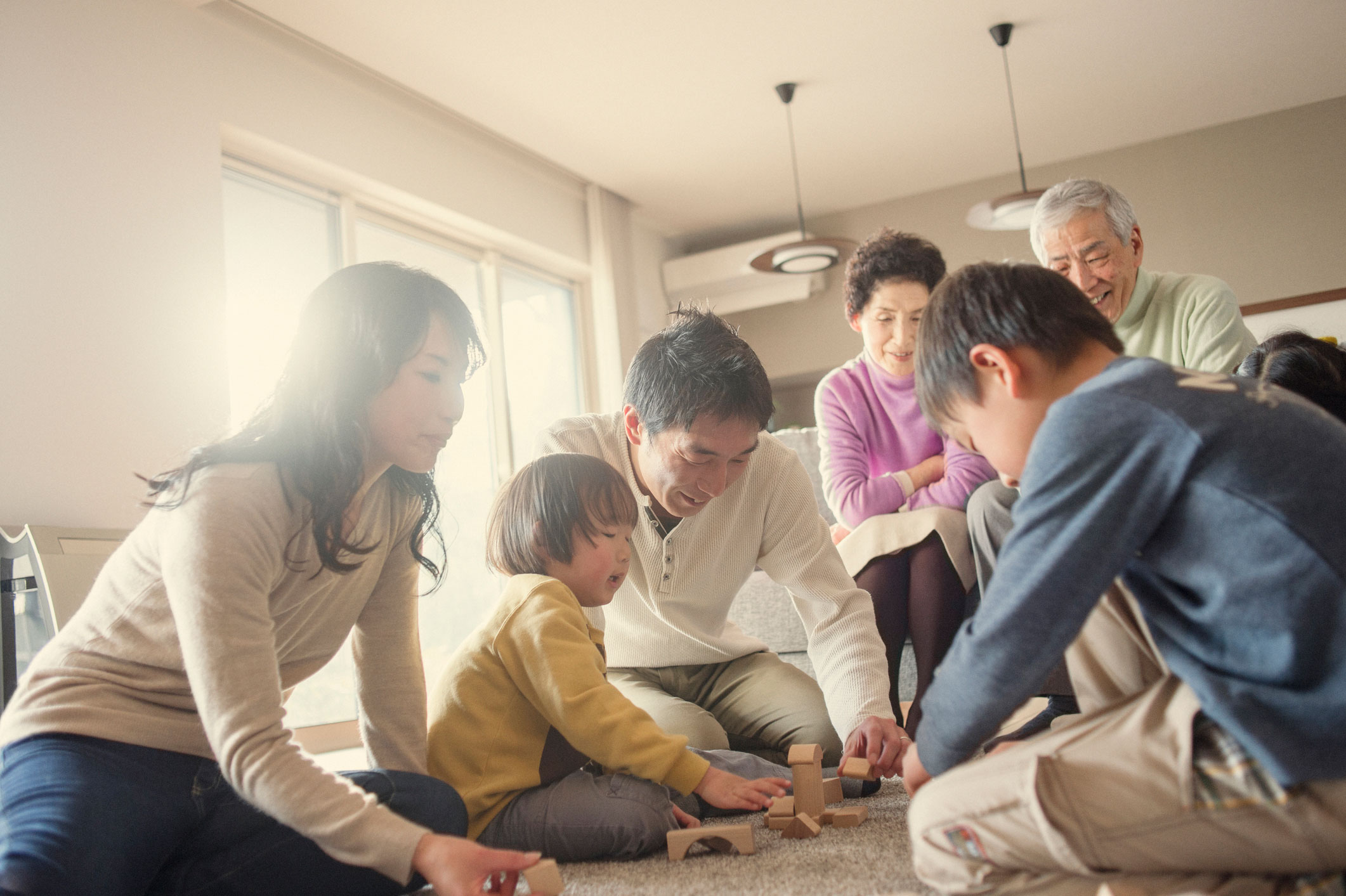 Multi-gen family playing with grandchildren 