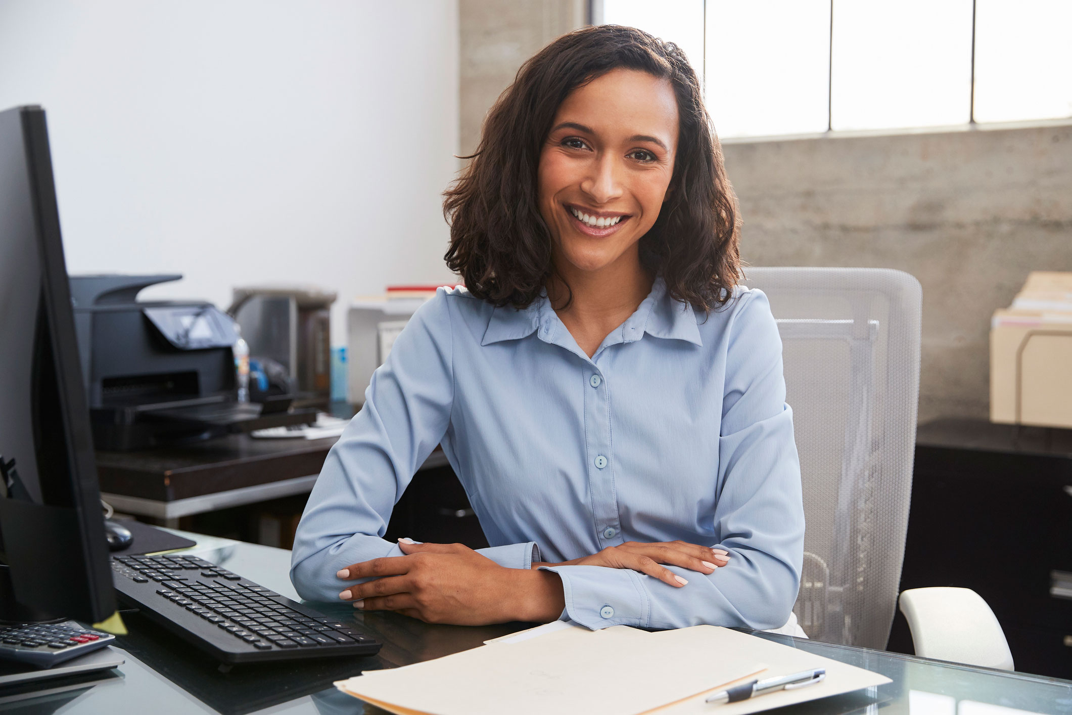 Woman at computer smiling