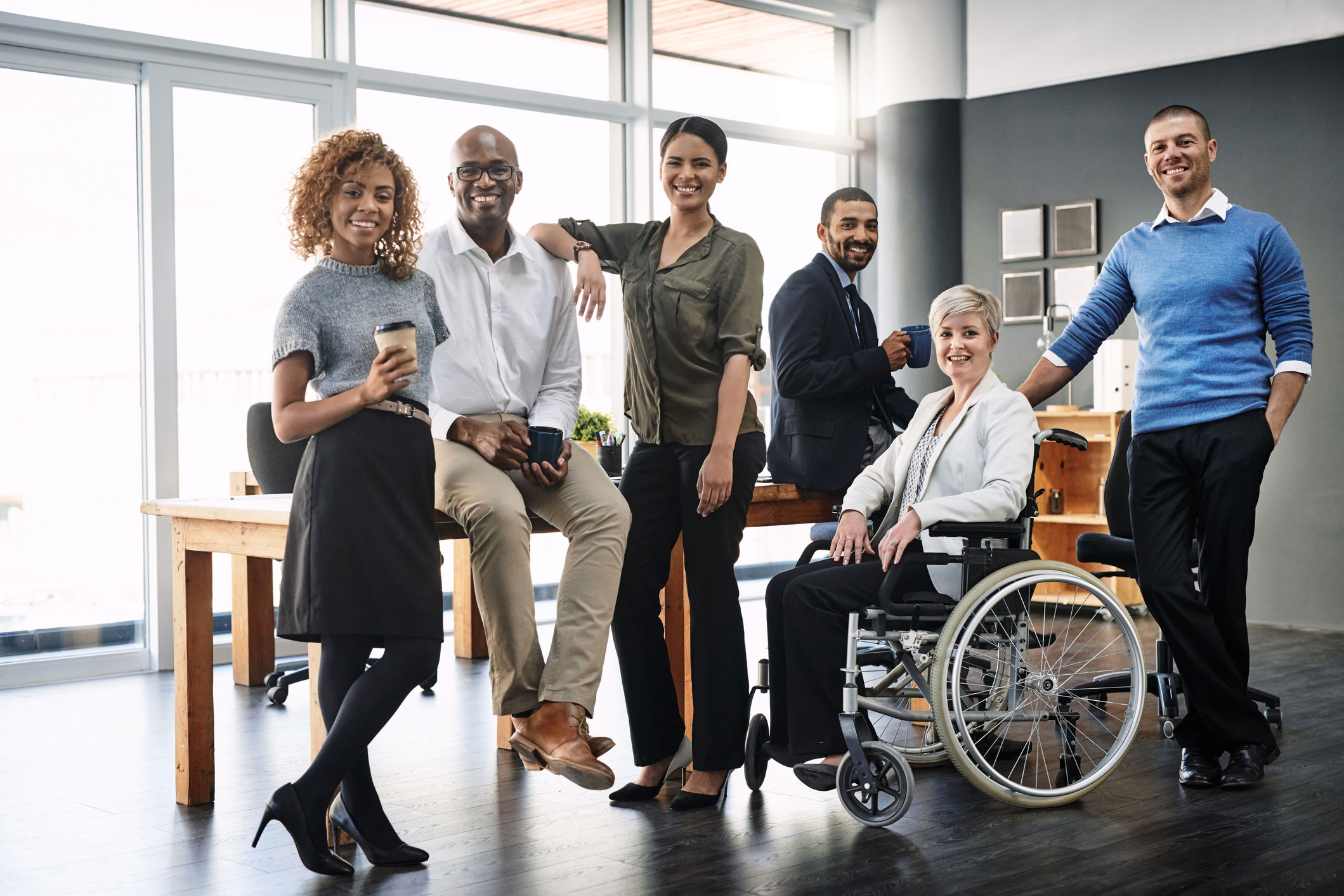 group of professionals by a table 