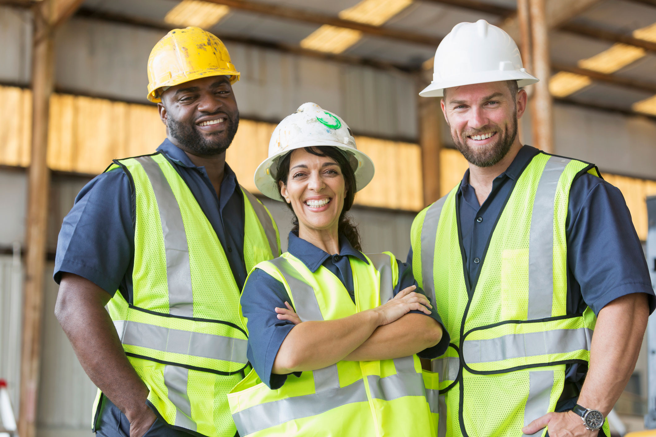 Group of workers standing together and smiling