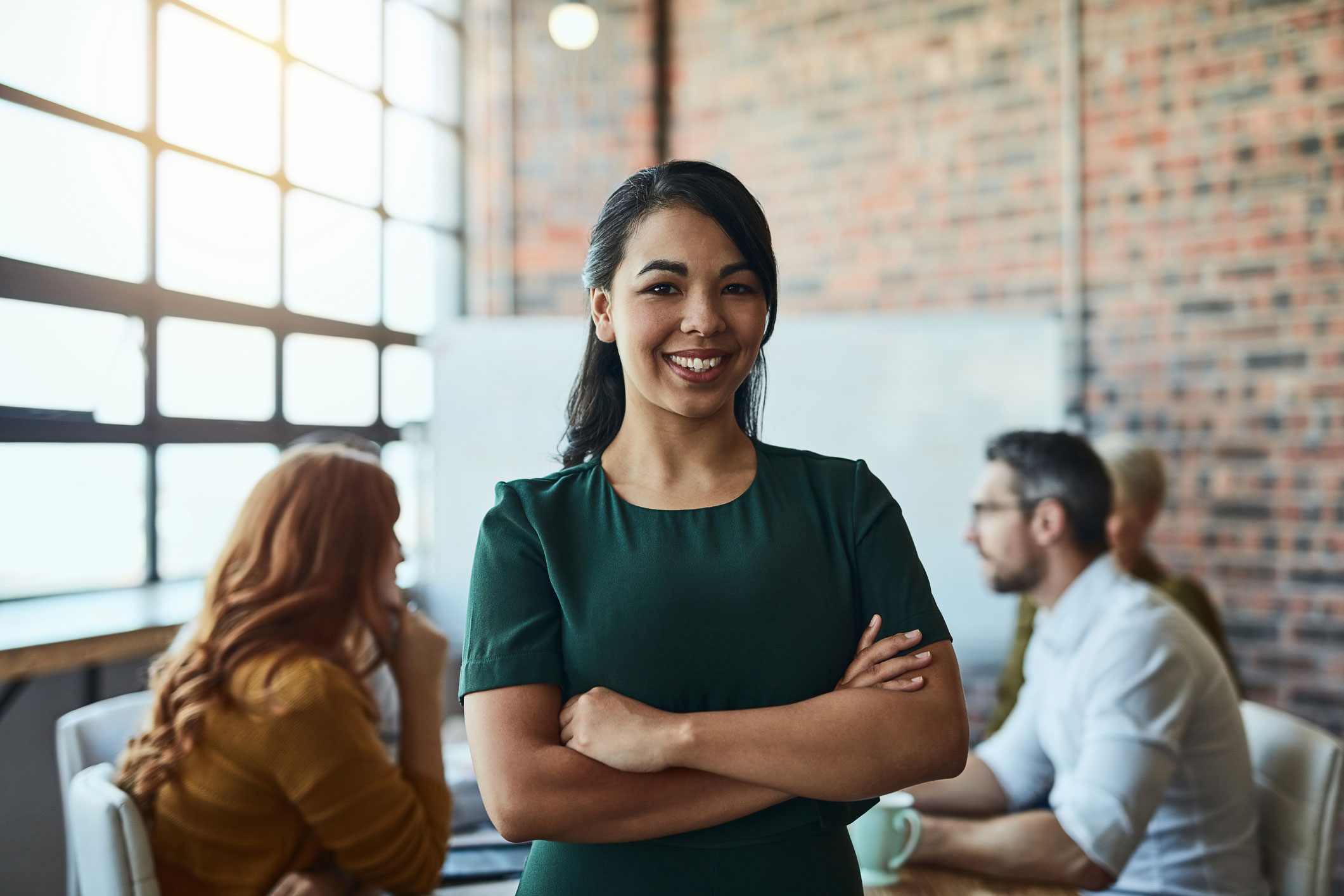 A young woman smiling at work