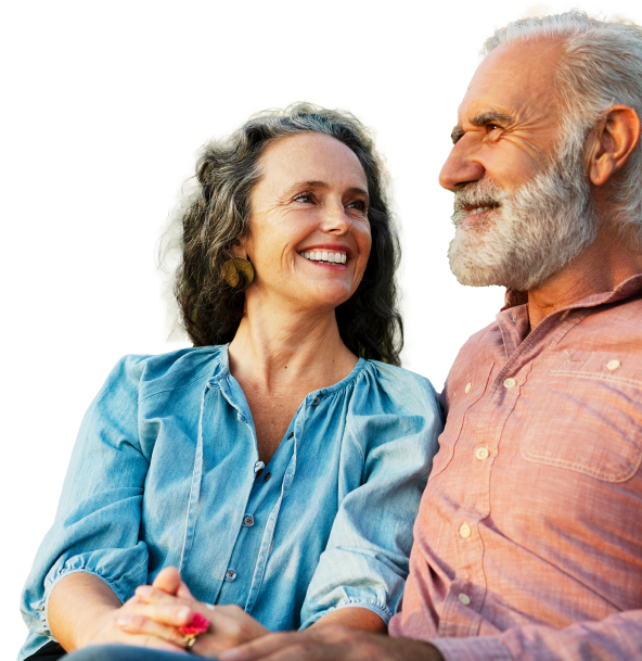 Older couple sits together, looking peaceful and relaxed.